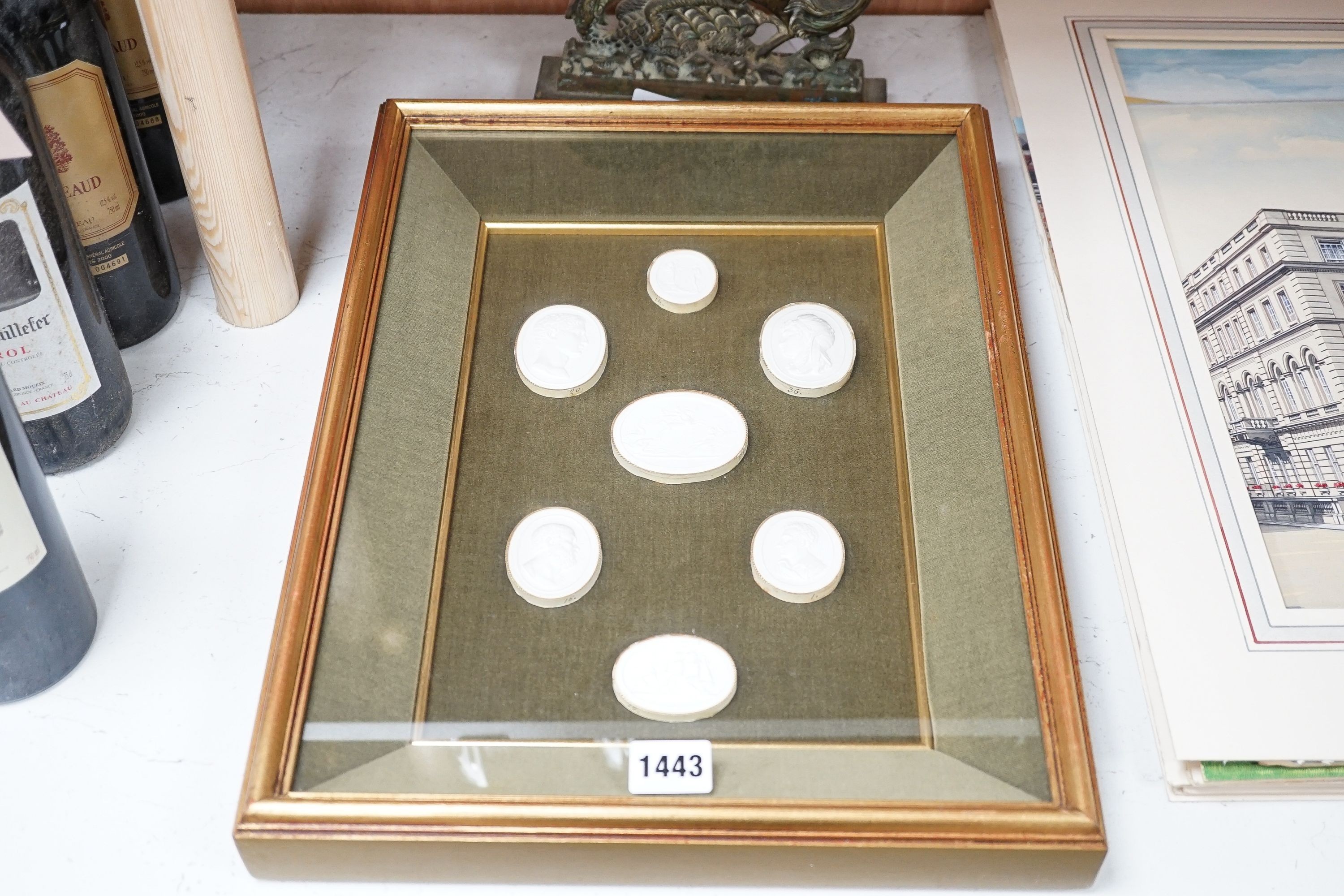 A reproduction cased set of seven classical plaster gems